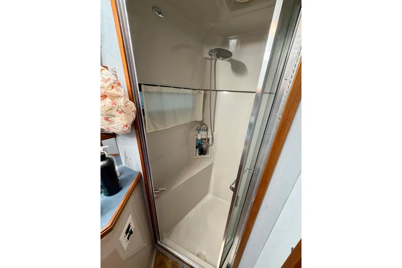 Slide: The Image of Shower area in 1987 Carver 4207 Aft Cabin Motor Yacht, featuring compact design. - 45