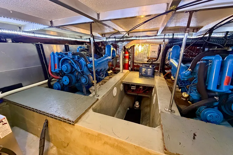 Slide: The Image of Engine room of 1987 Carver 4207 Aft Cabin Motor Yacht with blue engines. - 50