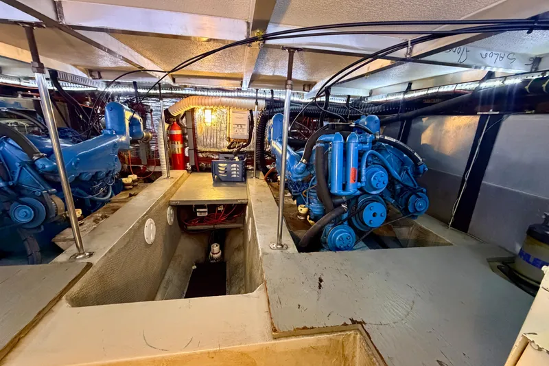 Slide: The Image of Engine room of 1987 Carver 4207 Aft Cabin Motor Yacht with blue machinery. - 51