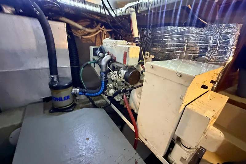 Slide: The Image of Engine room of 1987 Carver 4207 Aft Cabin Motor Yacht with Kohler generator. - 53