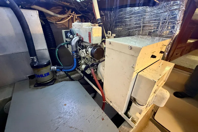 Slide: The Image of Engine room of 1987 Carver 4207 Aft Cabin Motor Yacht with Kohler generator. - 56