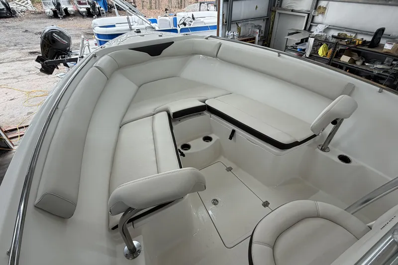 Slide: The Image of 2022 Sailfish 242 CC boat interior with spacious seating and modern design. - 12