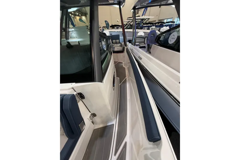 Slide: The Image of 2026 Monterey Elite 27 OB boat interior with sleek seating and modern design. - 12