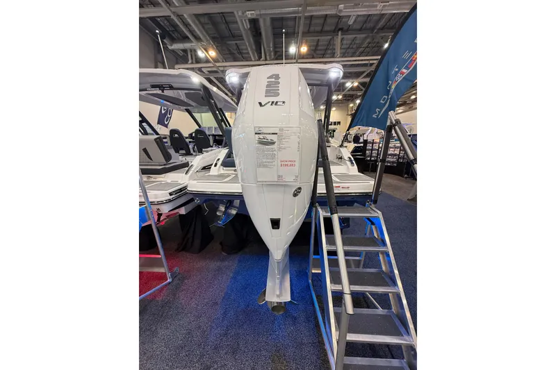 Slide: The Image of 2026 Monterey Elite 27 OB boat displayed at an indoor exhibition with price tag. - 3