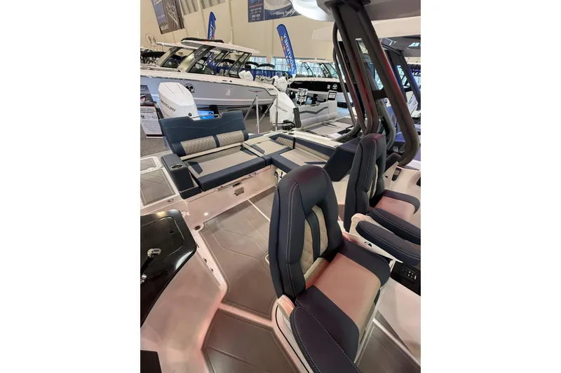 Slide: The Image of 2026 Monterey Elite 27 OB boat interior with luxurious seating and modern design. - 8