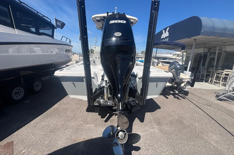 Slide: The Image of 2019 Sea Pro 248 Bay boat with powerful outboard motor, docked at a marina. - 3
