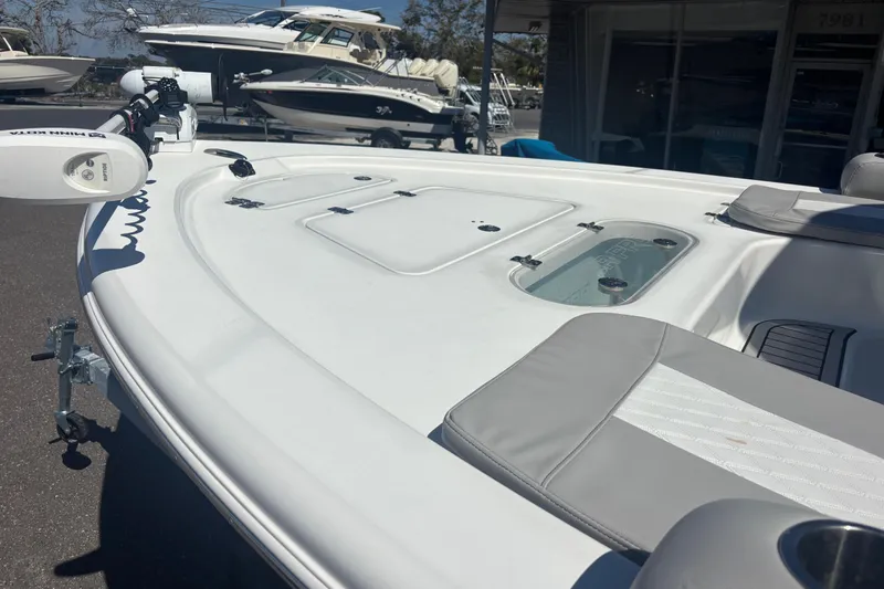 Slide: The Image of 2019 Sea Pro 248 Bay boat deck with seating and storage compartments. - 7