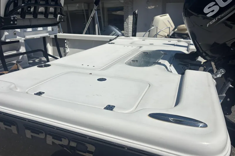 Slide: The Image of 2019 Sea Pro 248 Bay boat deck with motor and seating. - 9