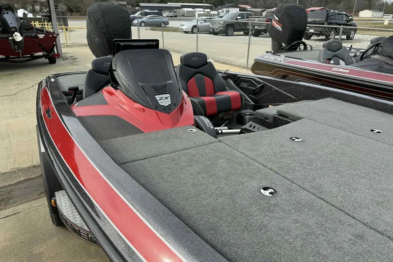Slide: The Image of 2019 Skeeter ZX200 bass boat with red accents and spacious deck. - 12