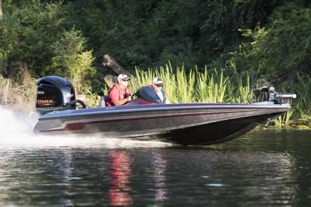 Slide: The Image of Manufacturer Provided Image: 2019 Skeeter ZX 200 boat speeding on a lake with two passengers. - 17