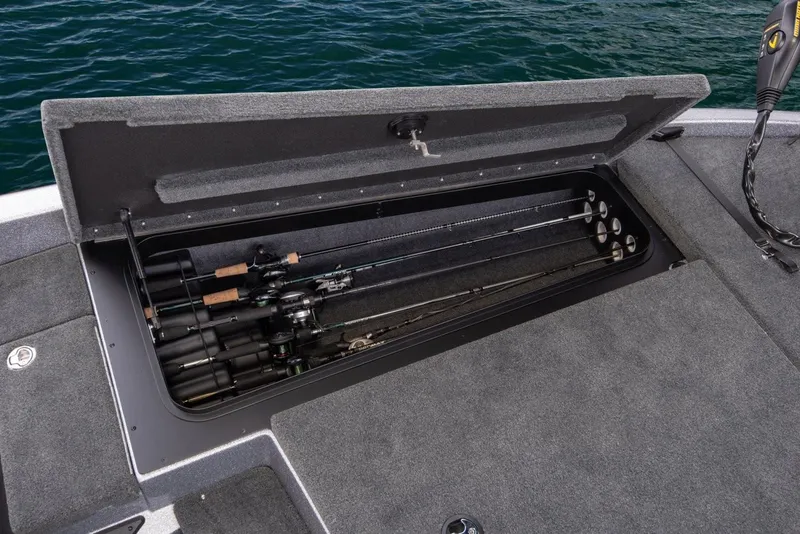 Slide: The Image of Manufacturer Provided Image: 2019 Skeeter ZX 200 boat with open storage compartment holding fishing rods. - 25