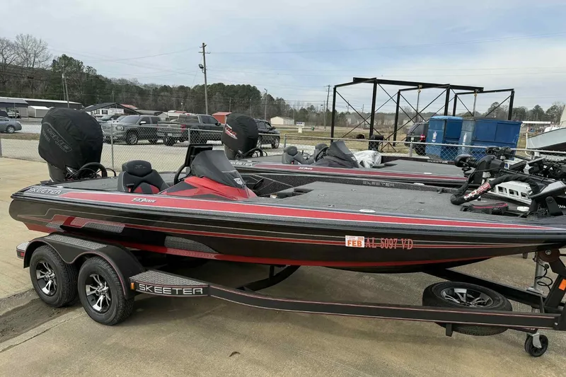 Slide: The Image of 2019 Skeeter ZX200 bass boat on trailer, parked outdoors. - 3