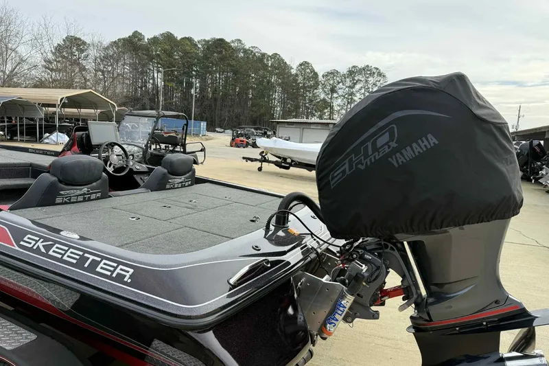 Slide: The Image of 2019 Skeeter ZX200 boat with Yamaha engine cover, parked outdoors. - 8