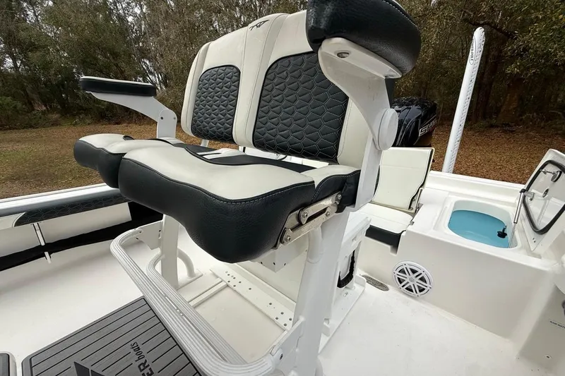 Slide: The Image of 2024 Tidewater 2300 Carolina Bay boat seat with black and white upholstery. - 14