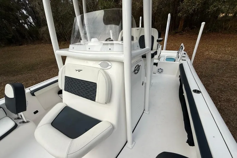 Slide: The Image of 2024 Tidewater 2300 Carolina Bay boat interior with seating and console. - 25