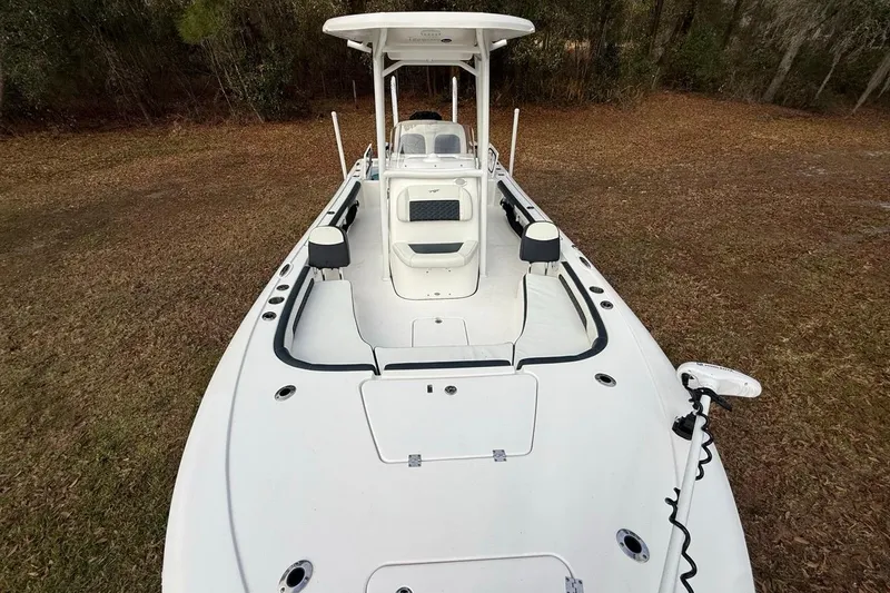 Slide: The Image of 2024 Tidewater 2300 Carolina Bay boat, white deck, spacious seating, outdoor setting. - 27