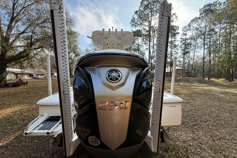 Slide: The Image of 2024 Tidewater 2300 Carolina Bay boat with powerful engine, parked outdoors. - 7