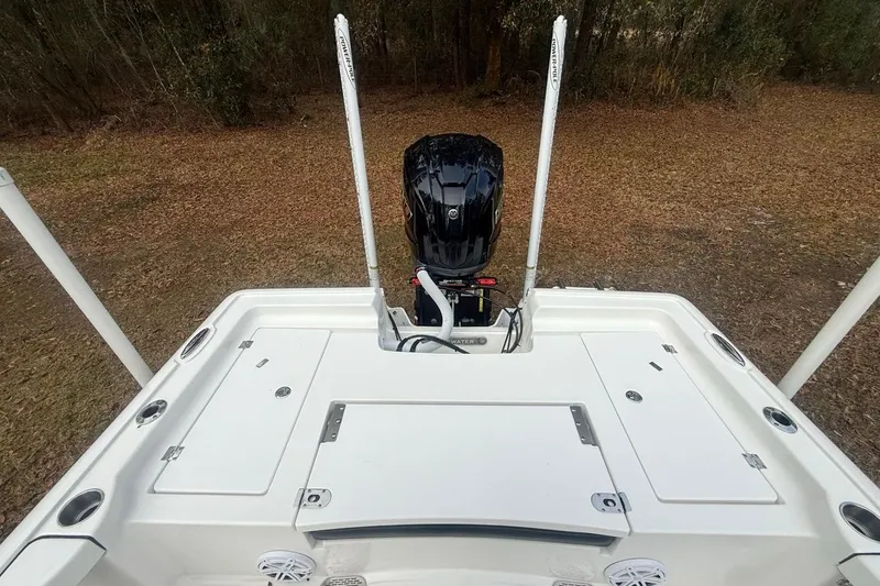 Slide: The Image of 2024 Tidewater 2300 Carolina Bay boat with outboard motor and spacious deck. - 9