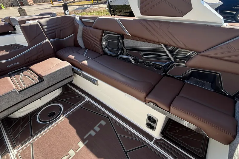 Slide: The Image of Luxurious interior of 2026 Tigé Ultré 25ZX boat with brown leather seating and modern design. - 10