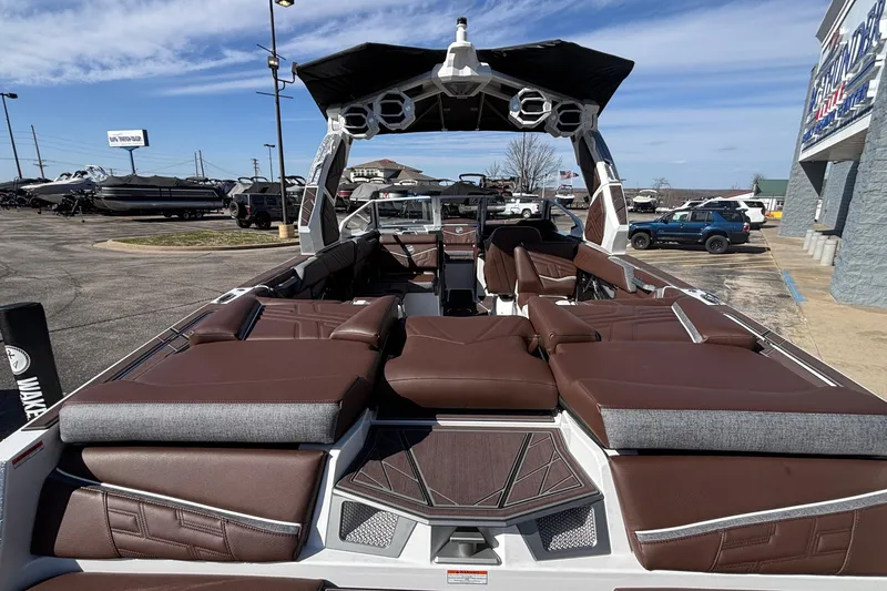 Slide: The Image of 2026 Tigé Ultré 25ZX boat with luxurious brown seating and modern design. - 14