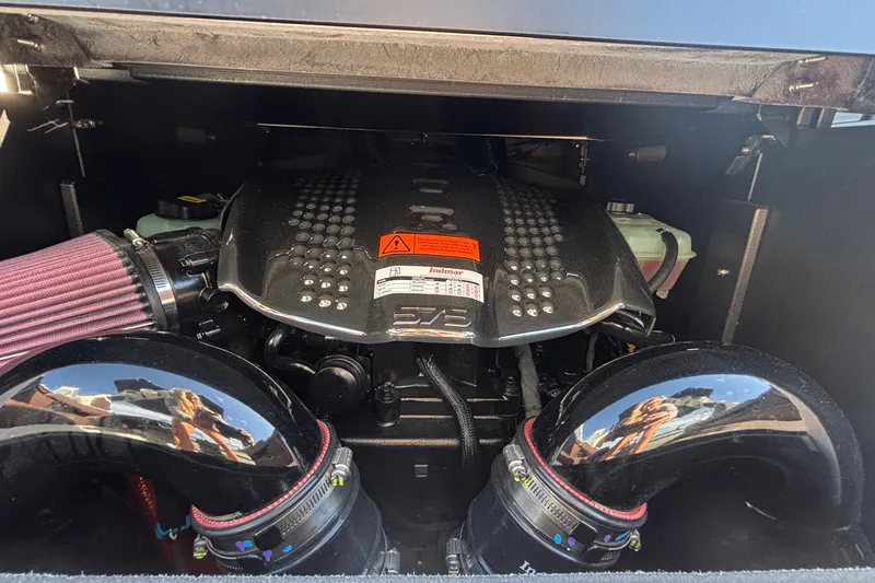 Slide: The Image of Engine compartment of 2026 Tigé Ultré 25ZX boat, featuring a powerful inboard motor. - 27