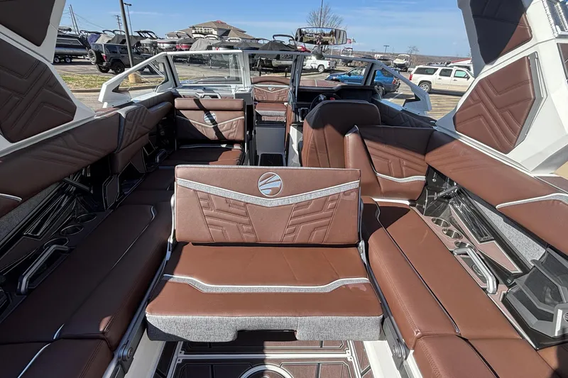 Slide: The Image of 2026 Tigé Ultré 25ZX boat interior with luxurious brown seating and modern design. - 35