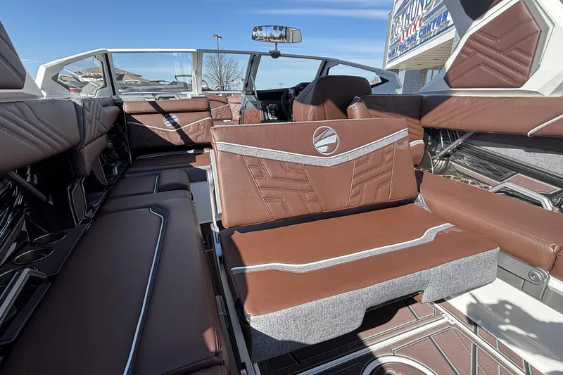 Slide: The Image of 2026 Tigé Ultré 25ZX boat interior with luxurious brown seating and modern design. - 36