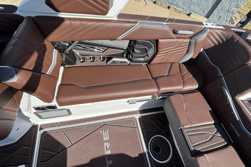 Slide: The Image of 2026 Tigé Ultré 25ZX boat interior with brown leather seating and modern design elements. - 41