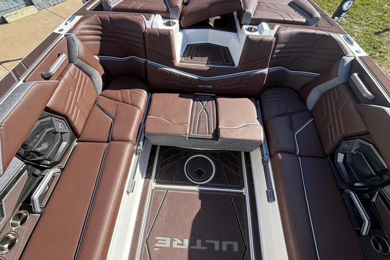 Slide: The Image of 2026 Tigé Ultré 25ZX boat interior with luxurious brown seating and modern design. - 42