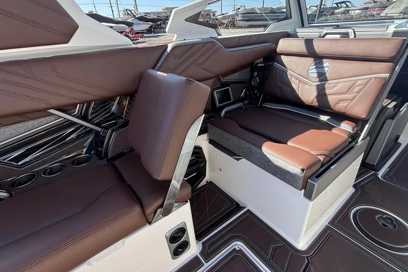 Slide: The Image of 2026 Tigé Ultré 25ZX boat interior with luxurious brown leather seating and modern design. - 44