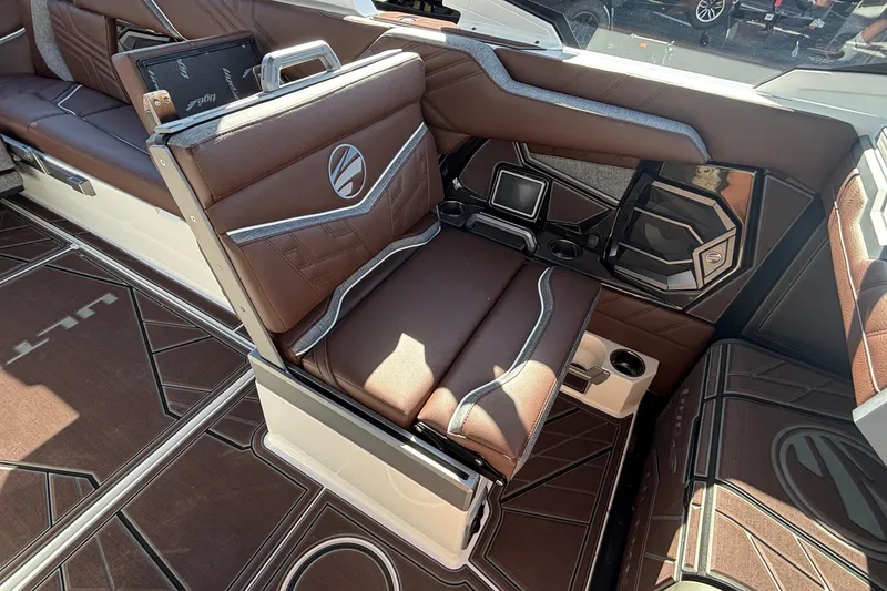 Slide: The Image of 2026 Tigé Ultré 25ZX boat interior with brown leather seating and modern design. - 48