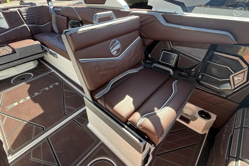 Slide: The Image of 2026 Tigé Ultré 25ZX boat interior with luxurious brown seating and stylish design. - 49