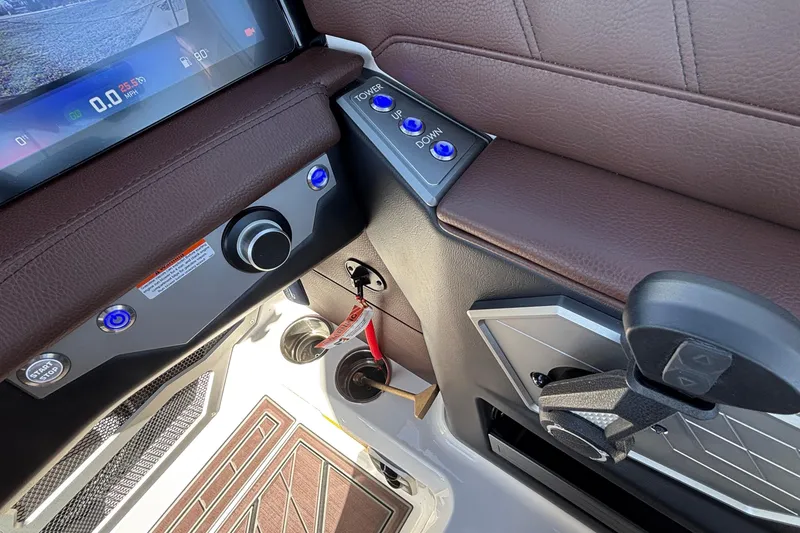 Slide: The Image of 2026 Tigé Ultré 25ZX boat dashboard with controls and touchscreen display. - 58