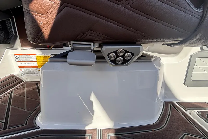 Slide: The Image of 2026 Tigé Ultré 25ZX boat interior with brown leather seat and detailed flooring. - 62