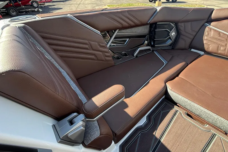 Slide: The Image of Luxurious interior of 2026 Tigé Ultré 25ZX boat with brown leather seating. - 66