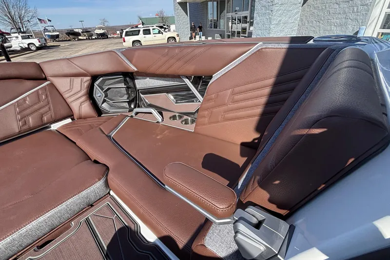 Slide: The Image of Luxurious brown leather seating in 2026 Tigé Ultré 25ZX boat interior. - 68
