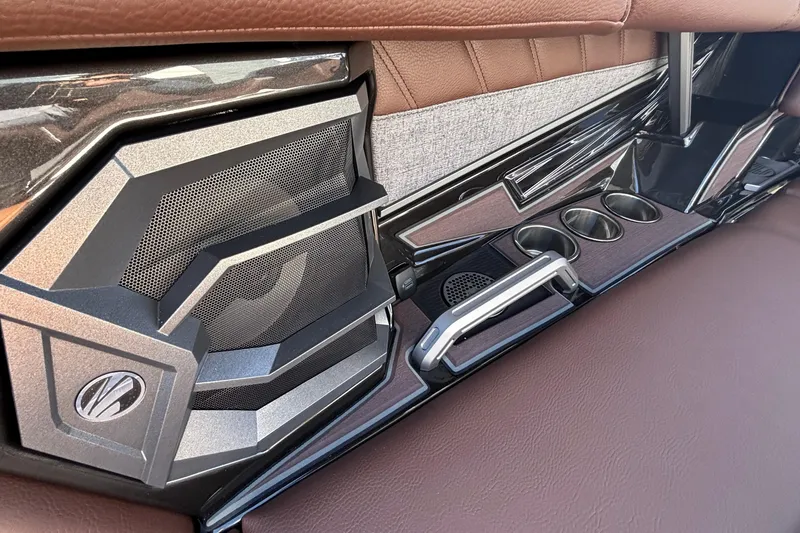 Slide: The Image of Interior of 2026 Tigé Ultré 25ZX boat with speaker and cup holders. - 77