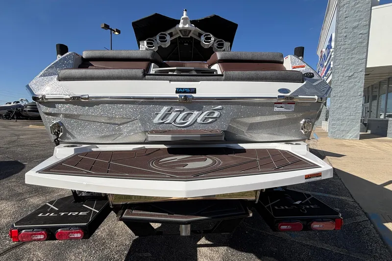 Slide: The Image of 2026 Tigé Ultré 25ZX boat rear view with sleek design and modern features. - 84