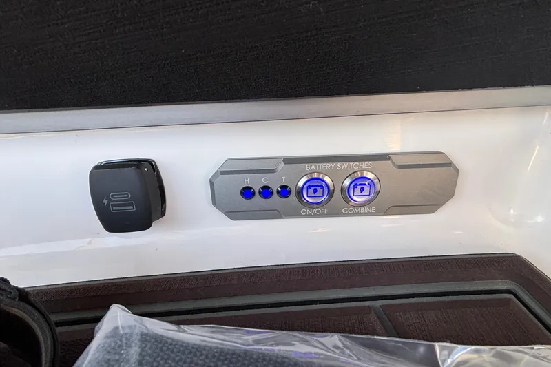 Slide: The Image of Control panel of 2026 Tigé Ultré 25ZX boat with battery switches and indicators. - 86
