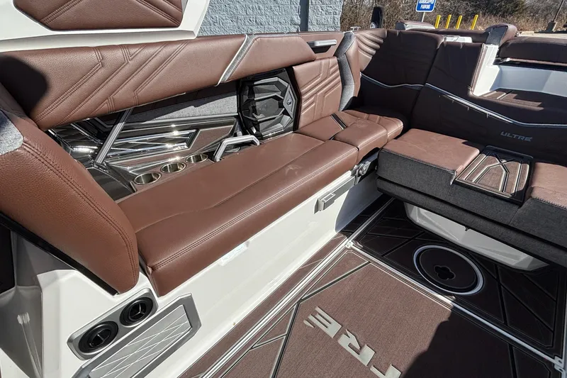 Slide: The Image of 2026 Tigé Ultré 25ZX interior with luxurious brown leather seating and modern design. - 9
