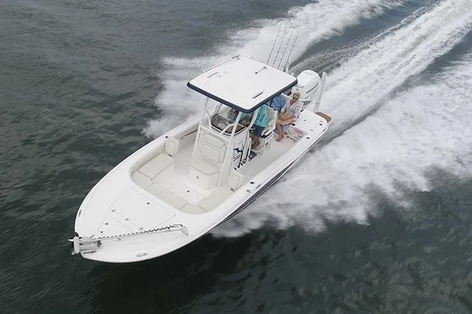 Slide: The Image of Manufacturer Provided Image: 2026 Caymas 26 HB boat cruising on open water, top view. - 2
