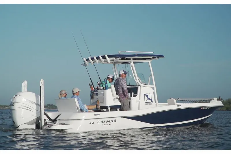 Slide: The Image of Manufacturer Provided Image: 2026 Caymas 26 HB boat on water with people fishing, clear sky background. - 3