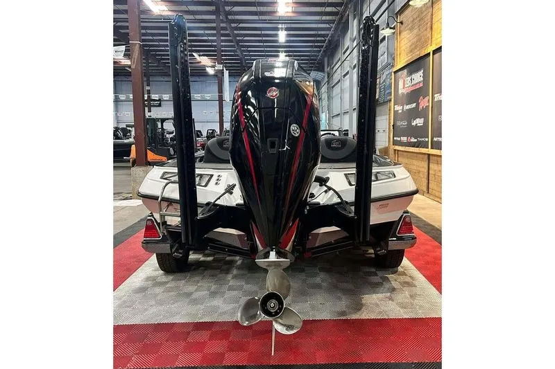 Slide: The Image of 2018 Ranger Z520L boat in showroom, rear view with motor and dual power poles. - 2