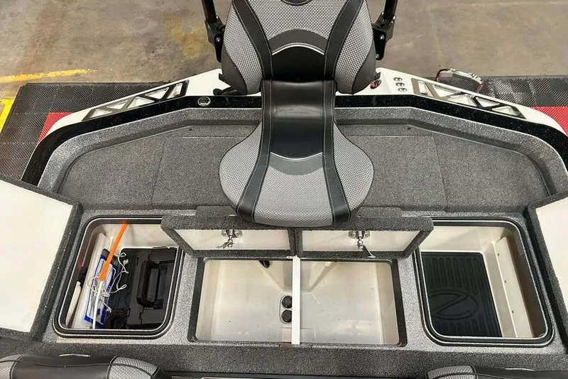 Slide: The Image of 2018 Ranger Z520L boat interior with storage compartments and seating. - 9