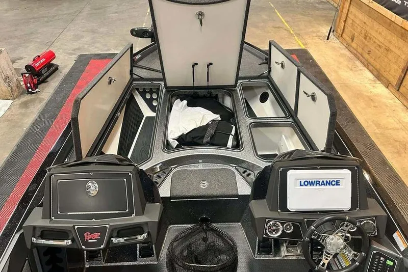 Slide: The Image of 2018 Ranger Z520L boat interior with storage compartments and Lowrance electronics. - 7