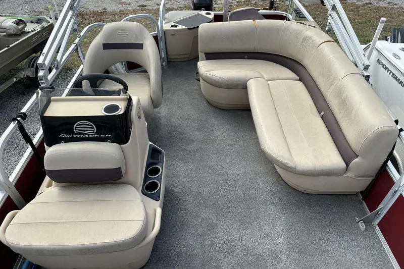 Slide: The Image of 2018 Sun Tracker Bass Buggy 18 DLX pontoon boat interior with seating and steering console. - 6