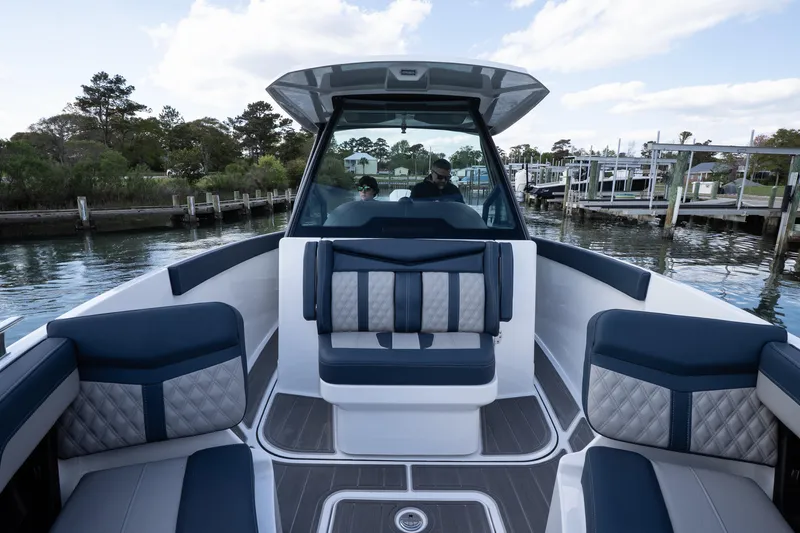 Slide: The Image of 2026 Monterey Elite 27 OB boat interior with luxurious seating and modern design. - 17