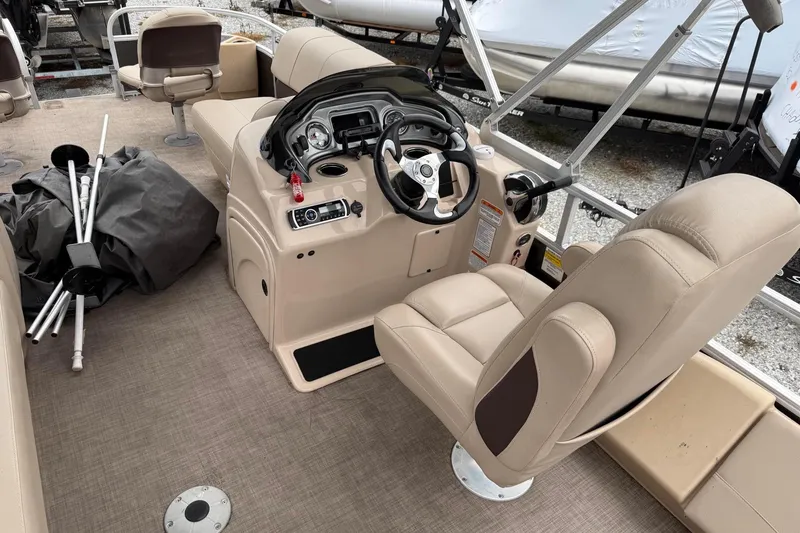 Slide: The Image of 2019 Sun Tracker Fishin' Barge 22 XP3 interior with steering console and seating. - 7