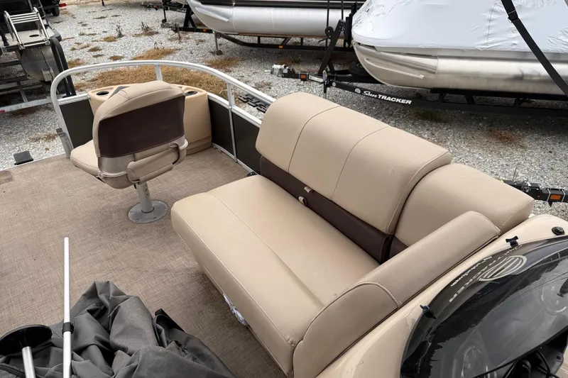 Slide: The Image of 2019 Sun Tracker Fishin' Barge 22 XP3 interior with beige seating and fishing chair. - 8