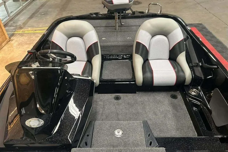 Slide: The Image of 2026 Ranger Z185 boat interior with dual seats and steering console. - 11